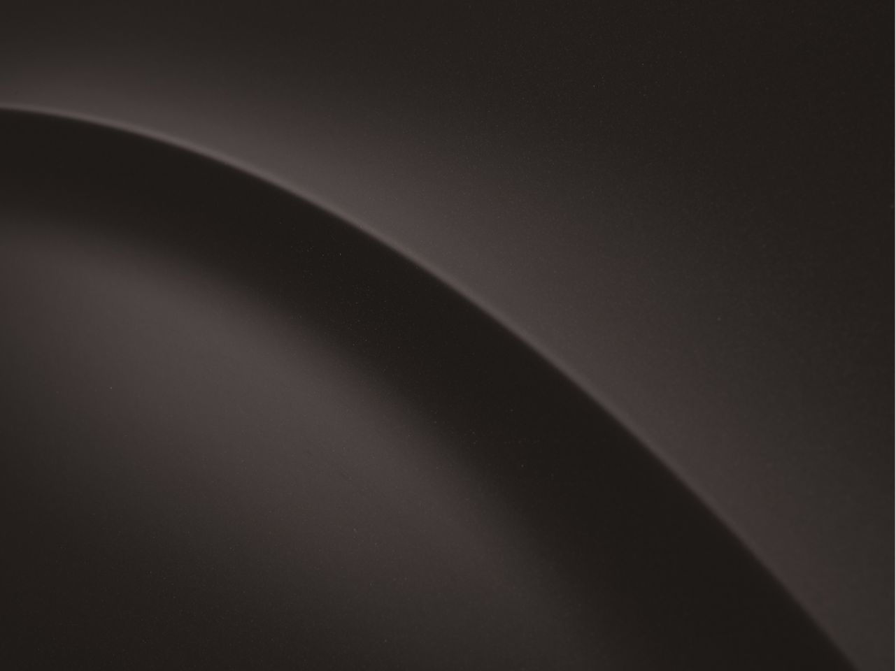 A black background with a curve in the middle of it