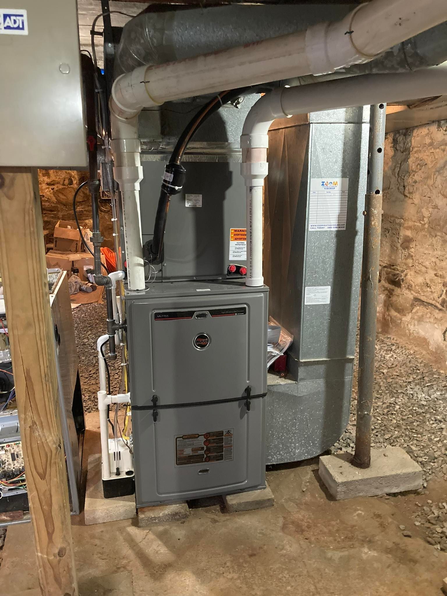 A heating and cooling system is installed in a basement.