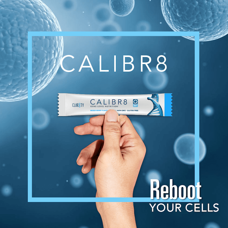 A person is holding a tube of calibr8 in their hand
