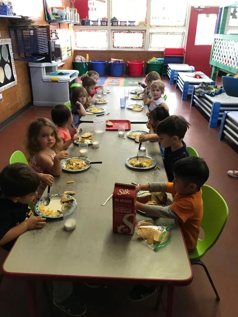 Students Eating their Food — Sacramento, CA — Tot Town Child Development Center, Inc.