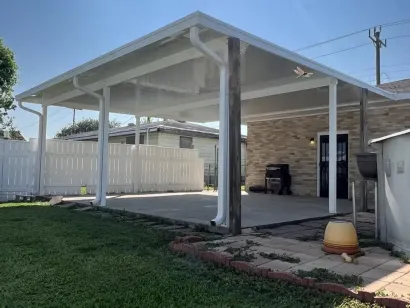 covered patio in front of home
