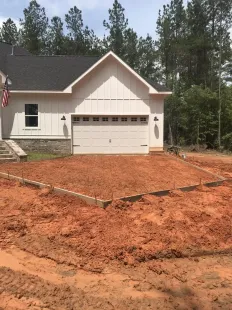 dirt work being done for a cement driveway