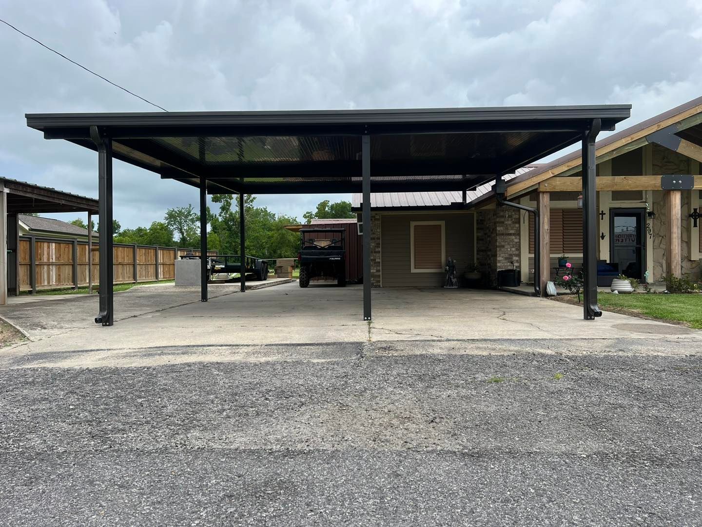 Thompson Construction built a Carport over a paved parking space at a home in mississippi