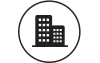 Two dark building silhouettes inside a white circle.
