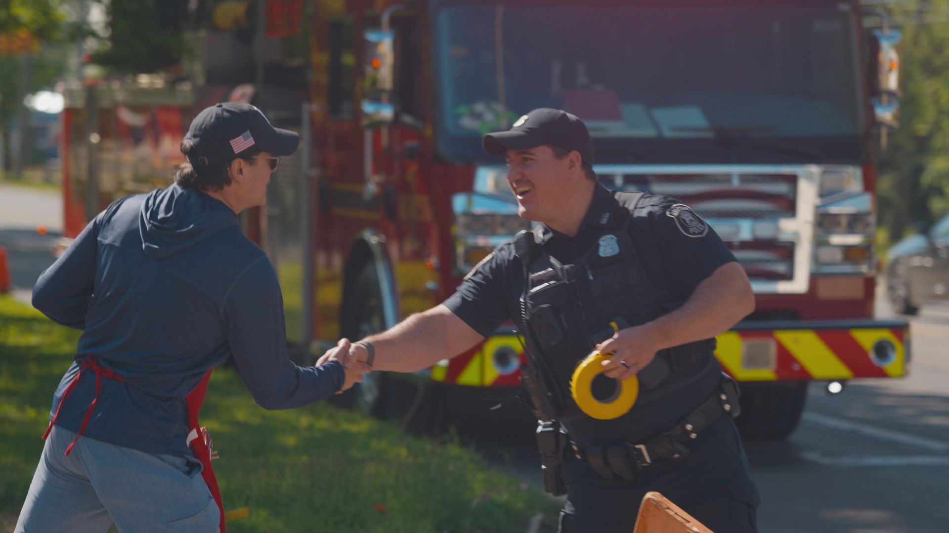Michael Sawicky in the memorial day parade in Farmington Hills shaking hands with firefighters 