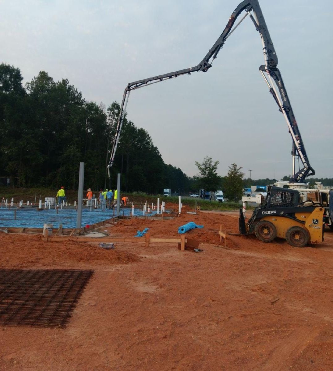 A concrete pump is being used on a construction site