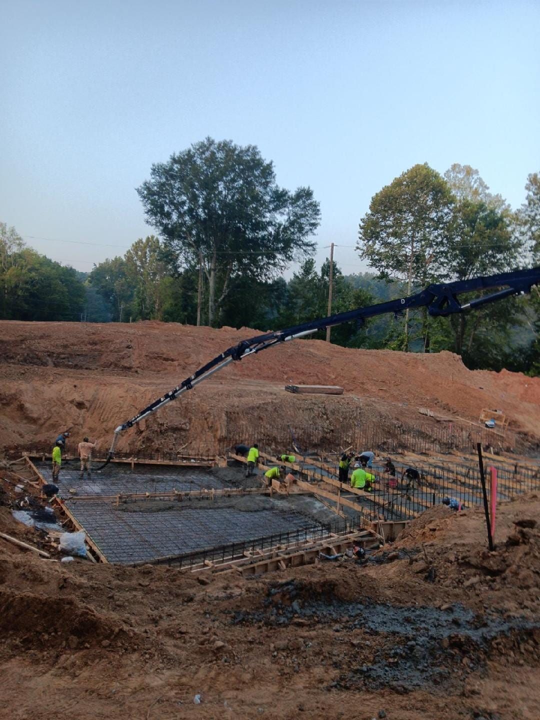 A group of construction workers are working on a construction site.