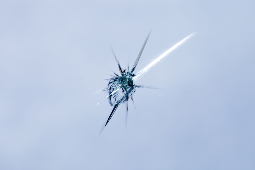 Close-up Of A Small Crack In A Window 