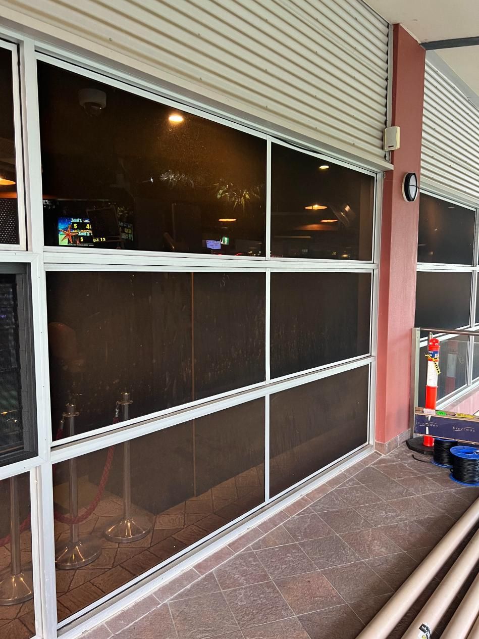 A Building With A Lot Of Windows And A Fire Extinguisher — Glass 24/7 In Taree, NSW