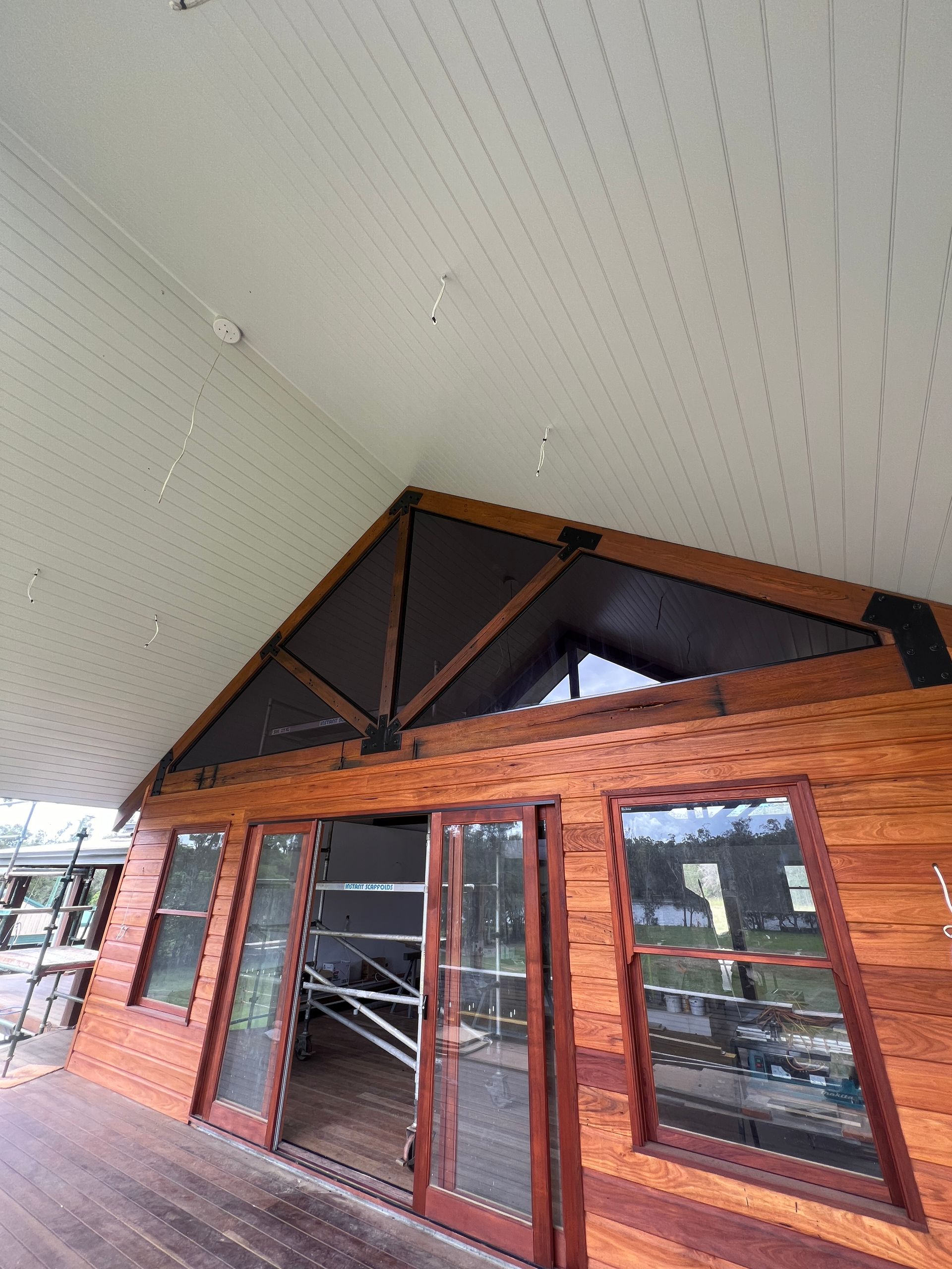 A White House With A Large Window On The Side Of It — Glass 24/7 In Taree, NSW