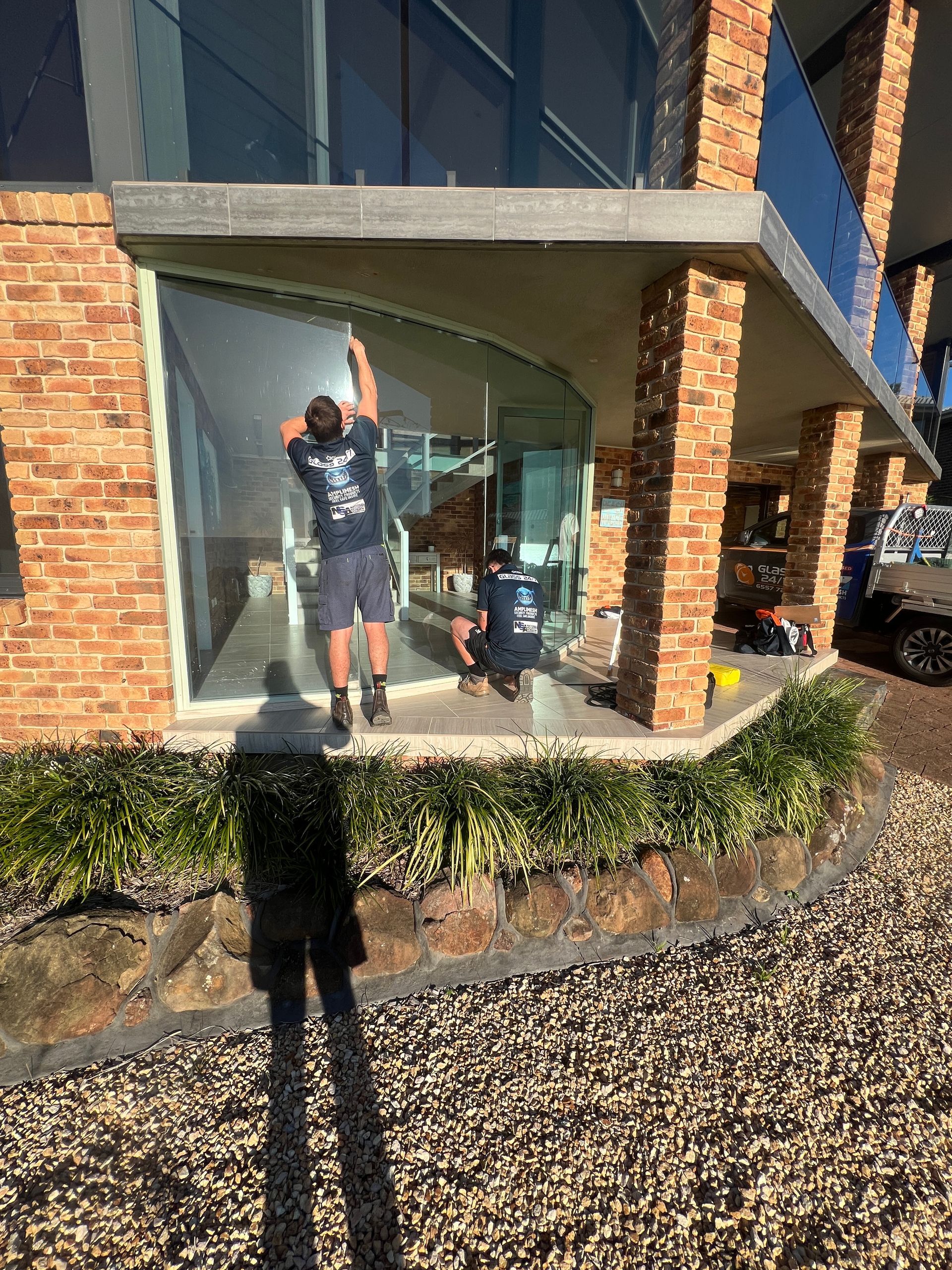 A person installing a window screen — Glass 24/7 In Taree, NSW