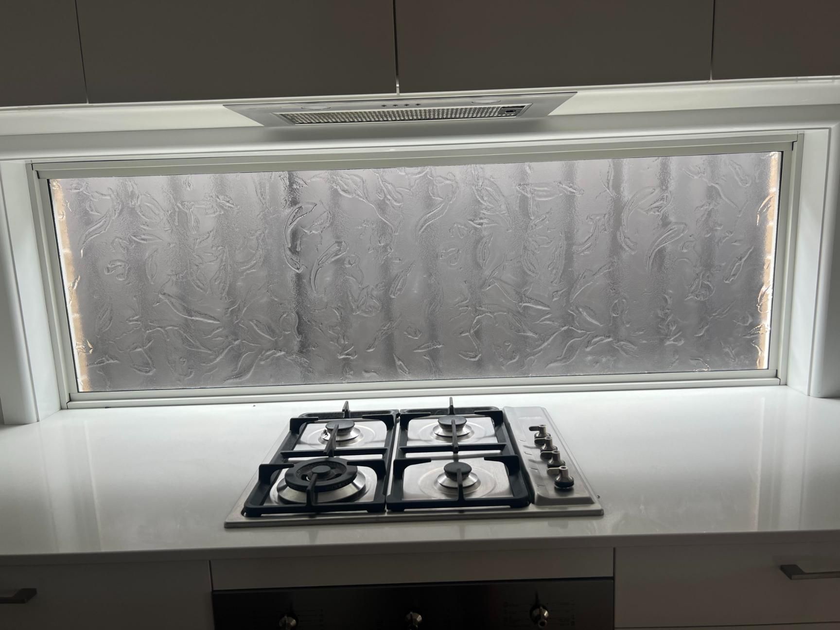 A Kitchen With A Stove Top Oven And A Window With Condensation On It — Glass 24/7 In Harrington, NSW