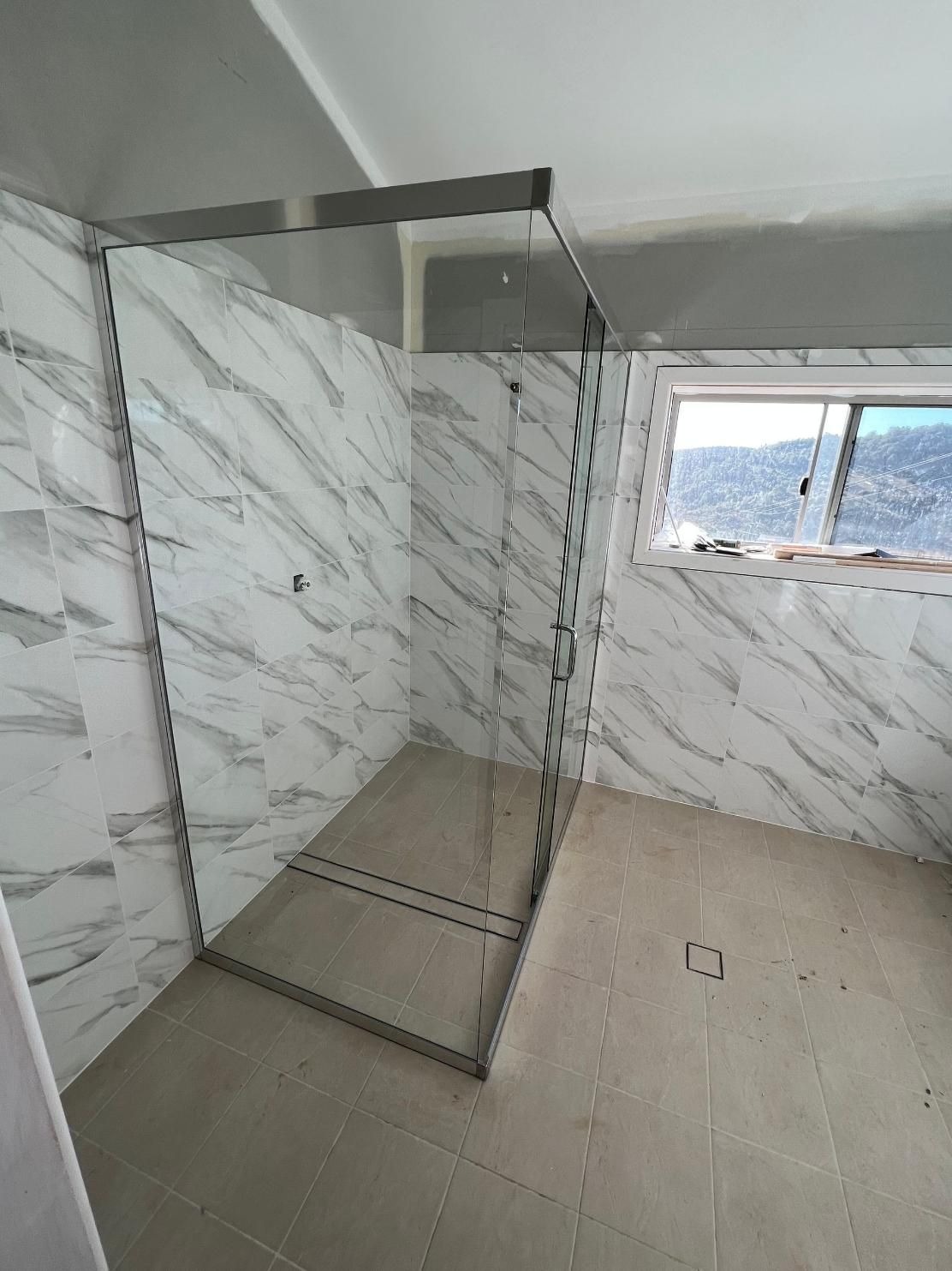 A Bathroom With Marble Walls And A Walk In Shower — Glass 24/7 In Hallidays Point, NSW