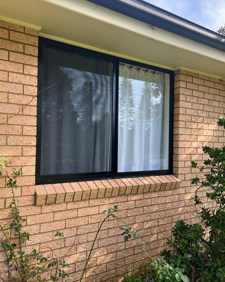 A Large Window On The Side Of A Brick House — Glass 24/7 In Tuncurry, NSW