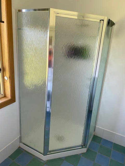 A Bathroom With A Shower Stall And A Window — Glass 24/7 In Taree, NSW