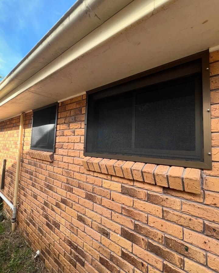 There Are Two Windows On The Side Of A Brick House — Glass 24/7 In Wingham, NSW
