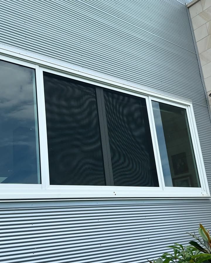 A Window With A Screen On It Is On The Side Of A Building — Glass 24/7 In Taree, NSW
