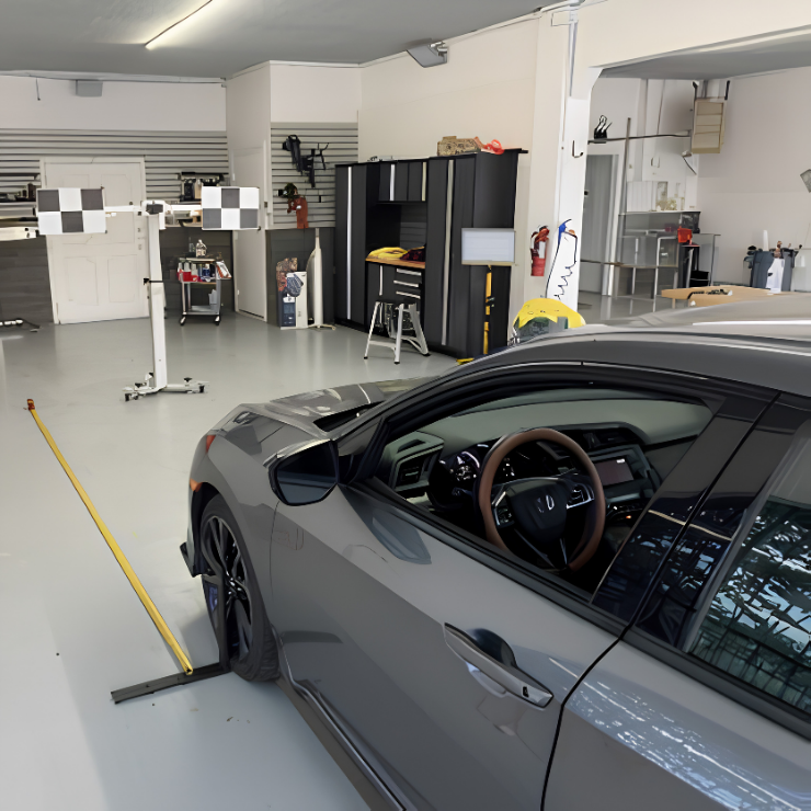 Gray sports car in Shine City Auto Glass's garage