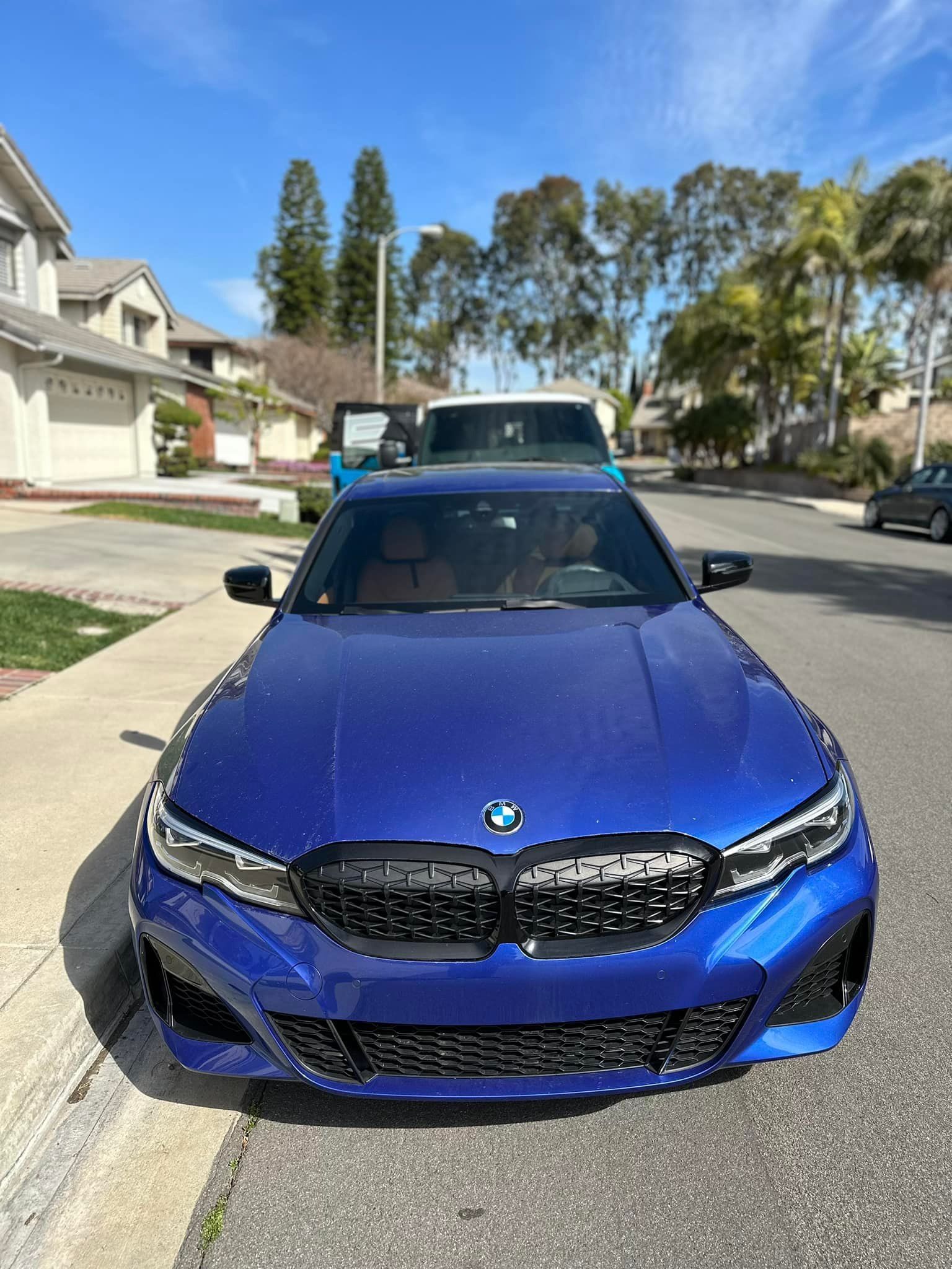 Blue BMW sedan repair