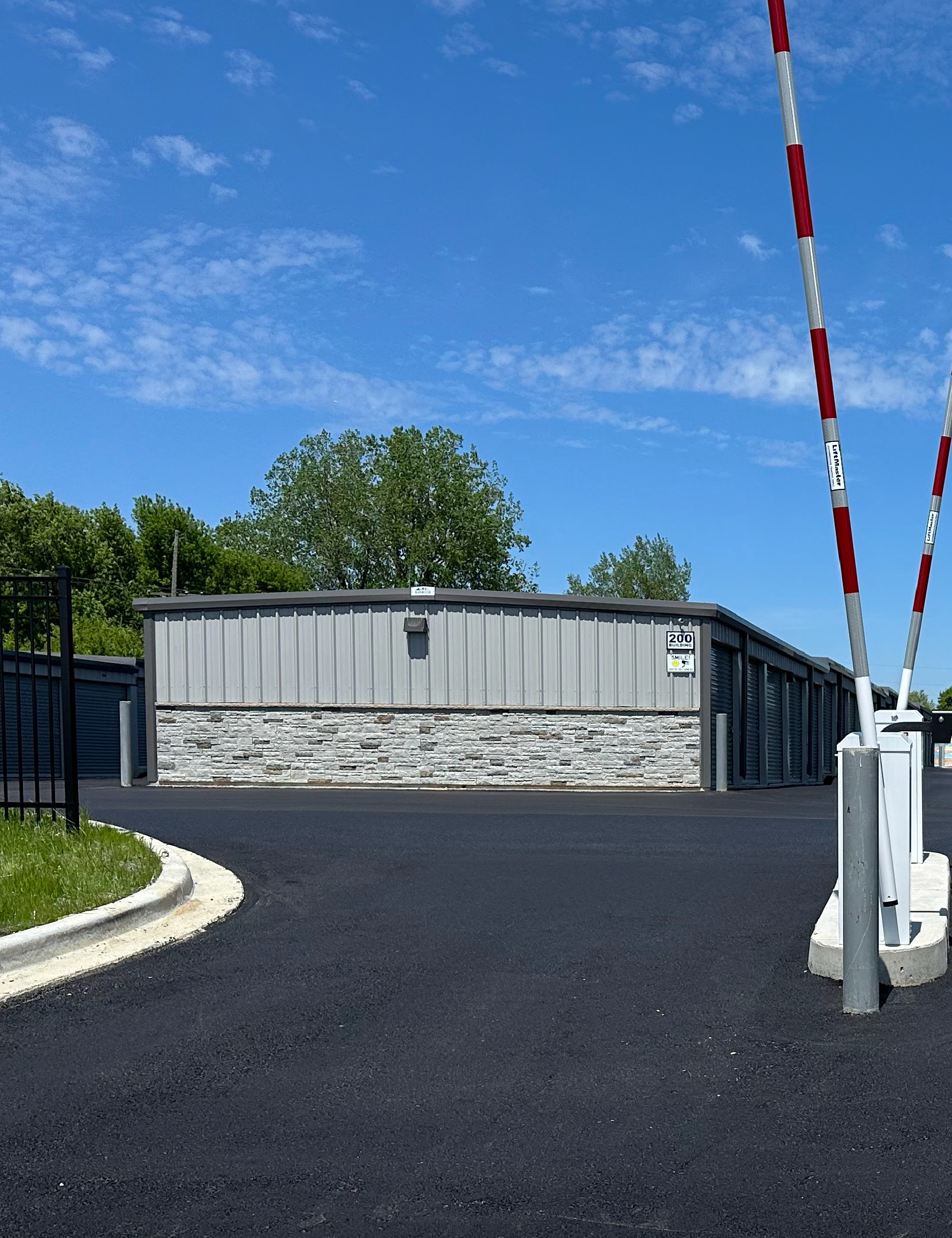 Secure gated entrance and modern storage units at Open City Self Storage in Elburn, Illinois.