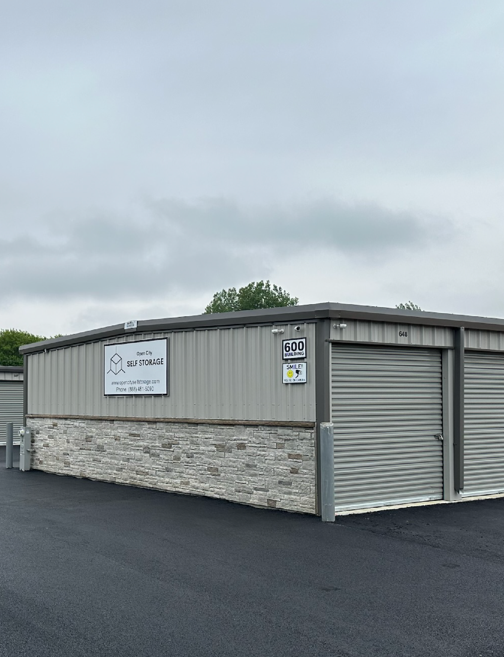 Modern drive-up storage units at Open City Self Storage in Elburn, IL with secure gated access.