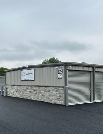 Modern drive-up storage units at Open City Self Storage in Elburn, IL with secure gated access.