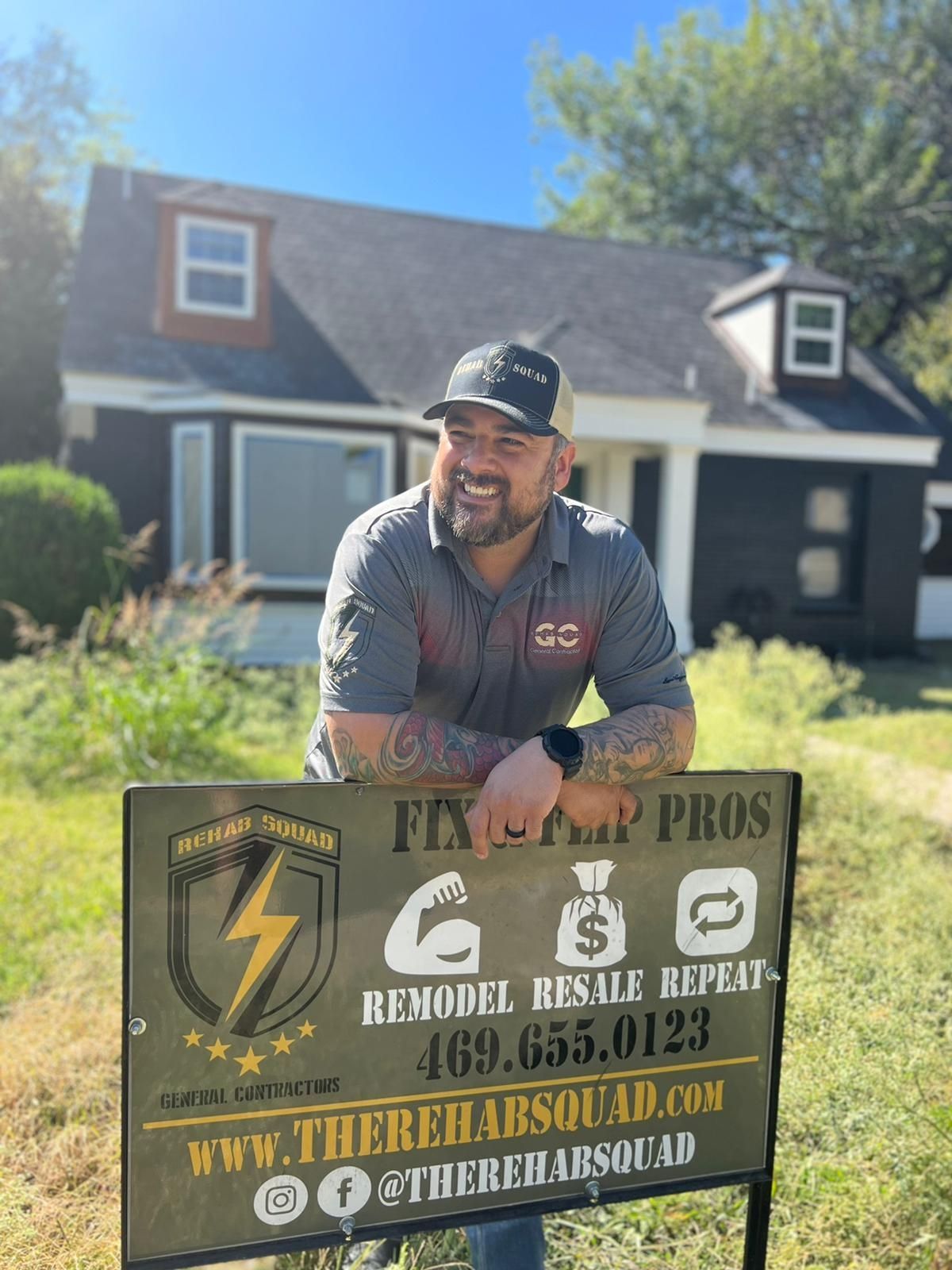 Owner and operator of Rehab Squad Restoration and Remodeling smiling in front of an investment property rehab completed for a fix and flip project in Oak Cliff Dallas Texas