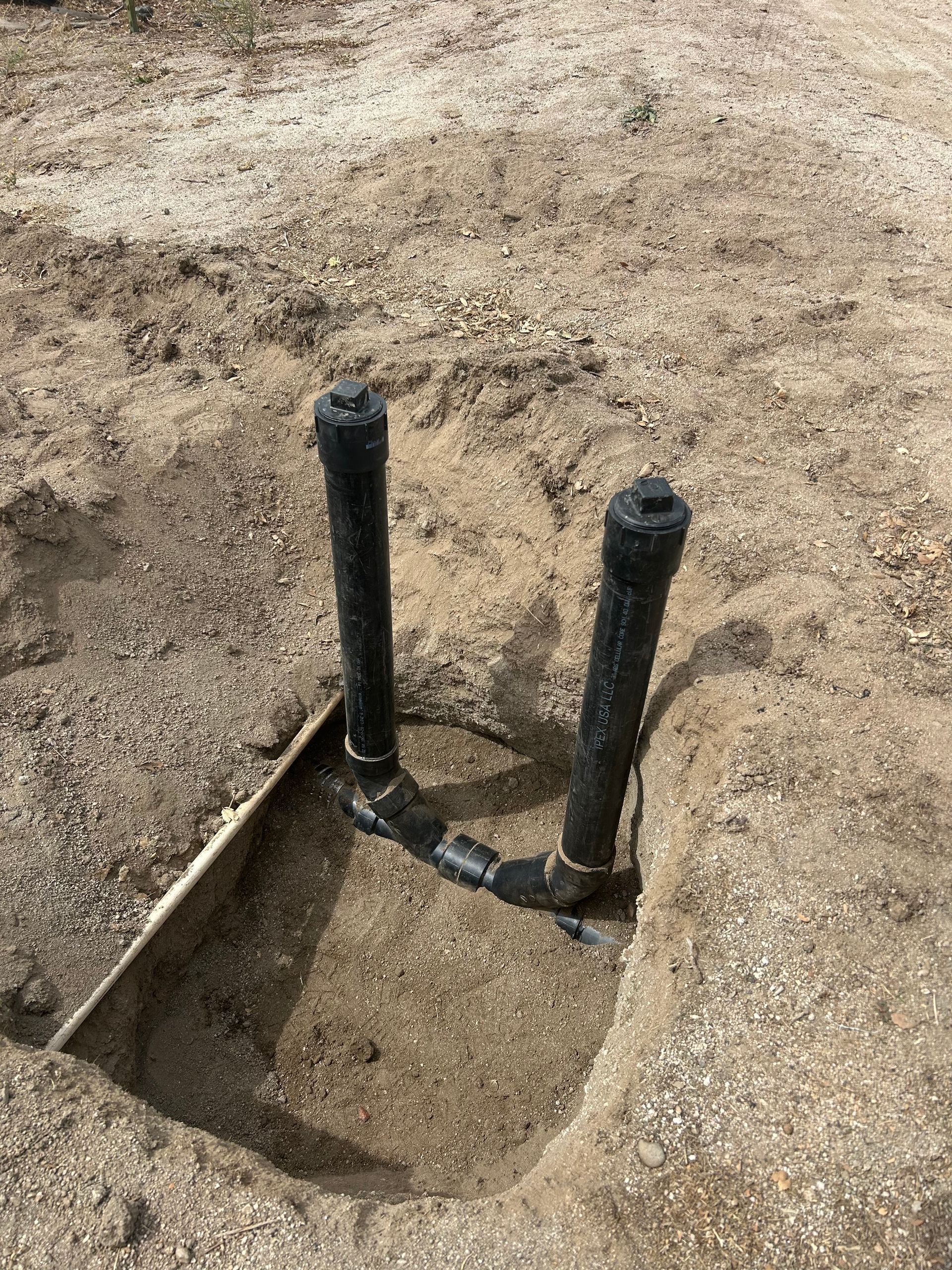 New double sweep sewer clean-outs installed in the ground