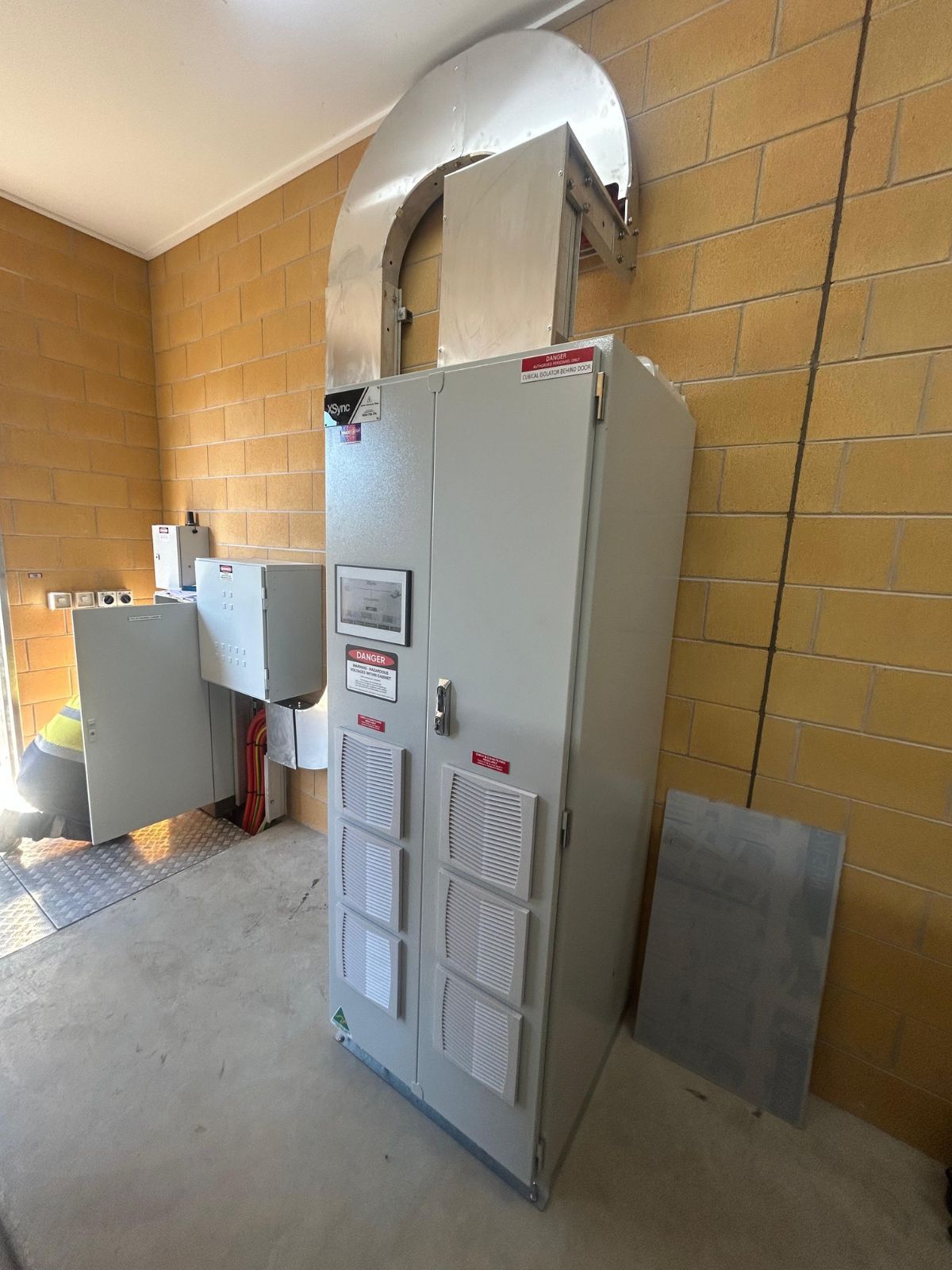 side view of active harmonic filter installed on concrete floor
