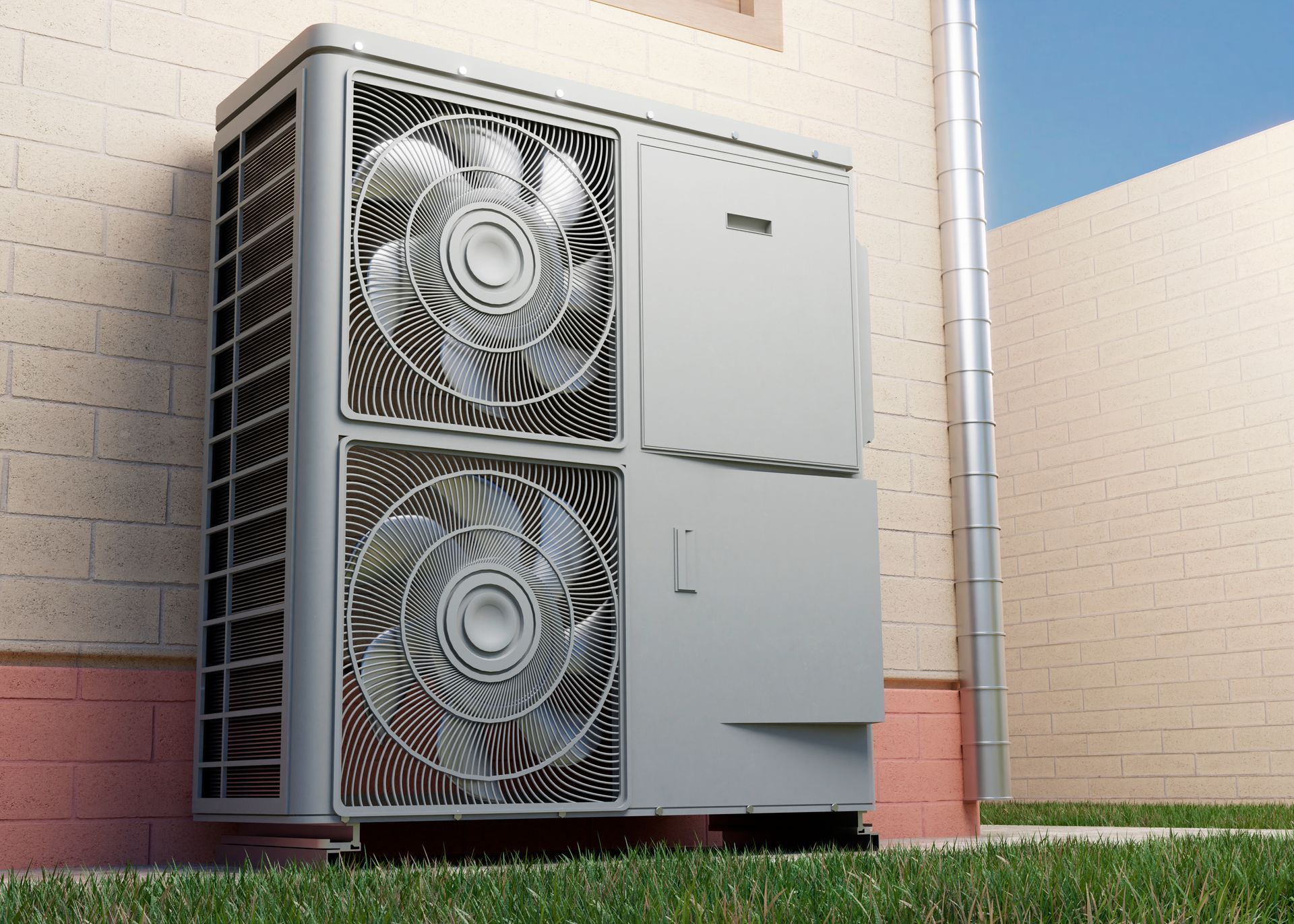 Outdoor heat pump unit attached to a brick wall, with two fan housings.