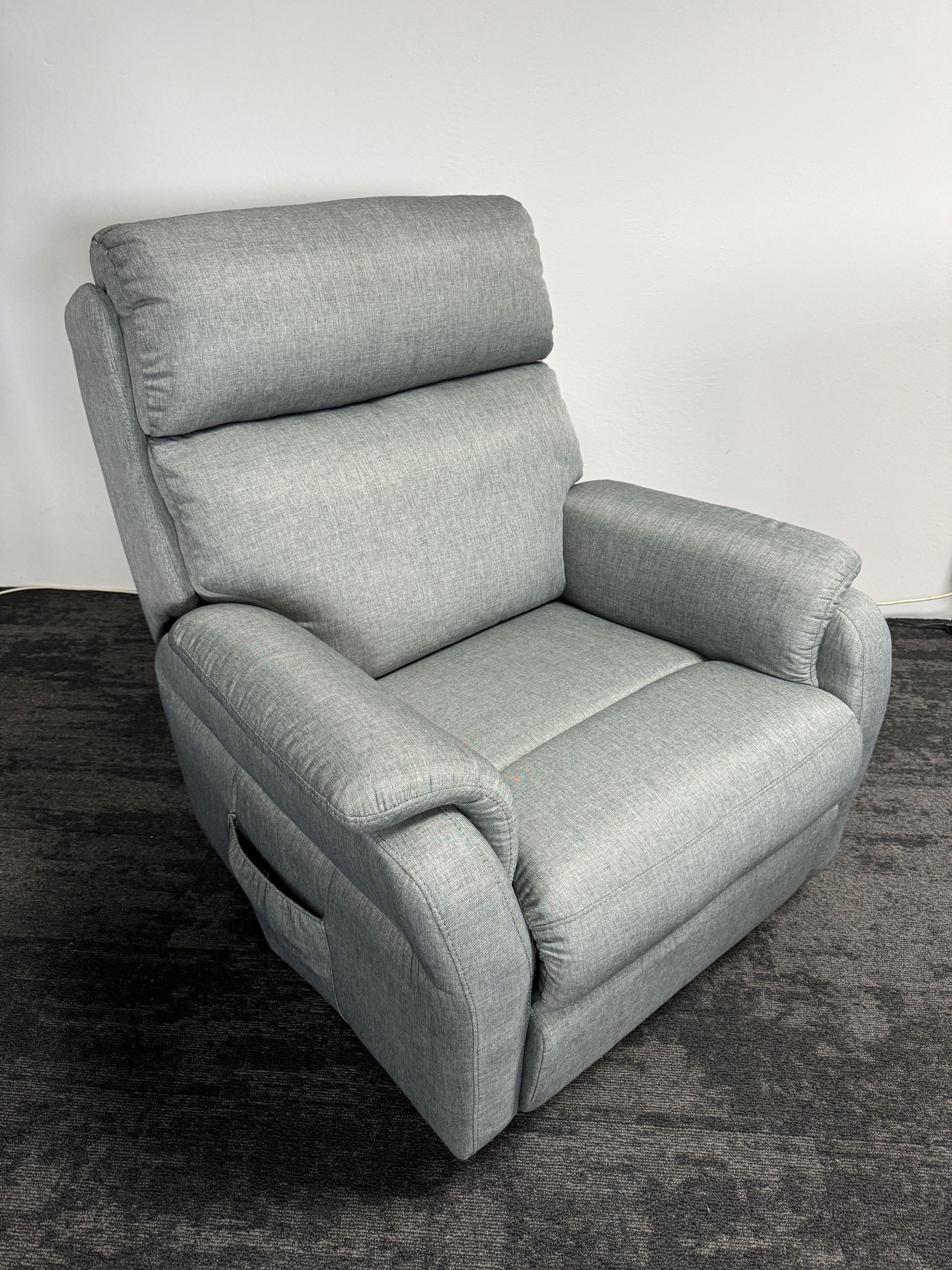 A leather four motor lift chair isolated on a white background. A leather four motor lift chair isolated on a white background.