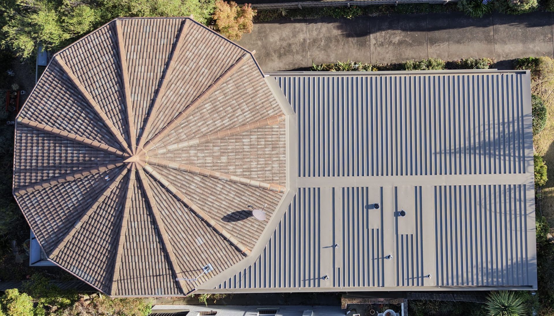 Aerial View of a Round-roofed Building Beside a Rectangular Corrugated Metal Roof — Hinch Plumbing In Breakwater, VIC
