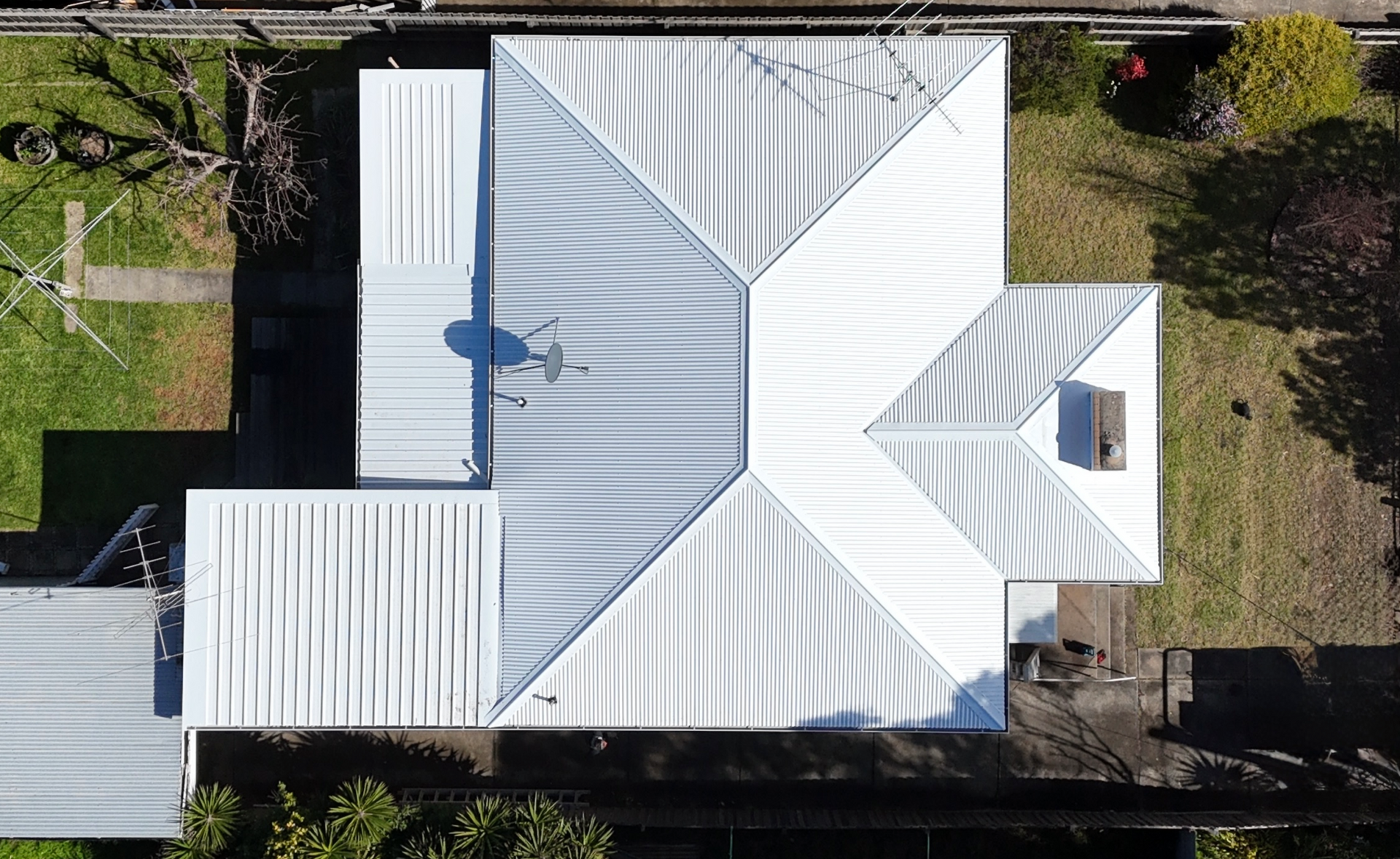 White Metal-roof House With a Small Porch — Hinch Plumbing In Breakwater, VIC