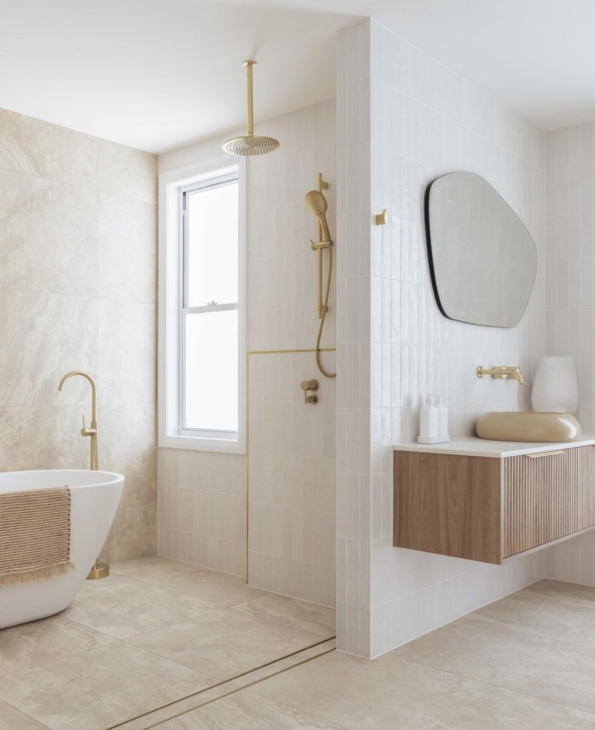 Bright Beige Bathroom With a Freestanding Tub, Walk-in Shower, and Floating Vanity — Hinch Plumbing In Breakwater, VIC