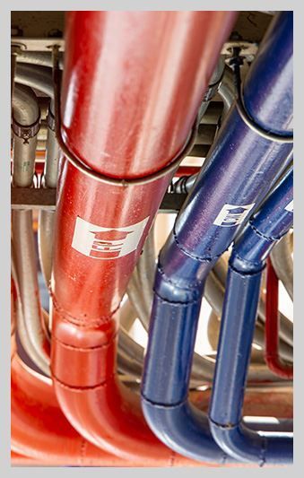 A bunch of red and blue pipes are connected to each other.