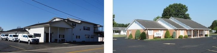 Two small white commercial buildings with parked cars on a sunny street corner
