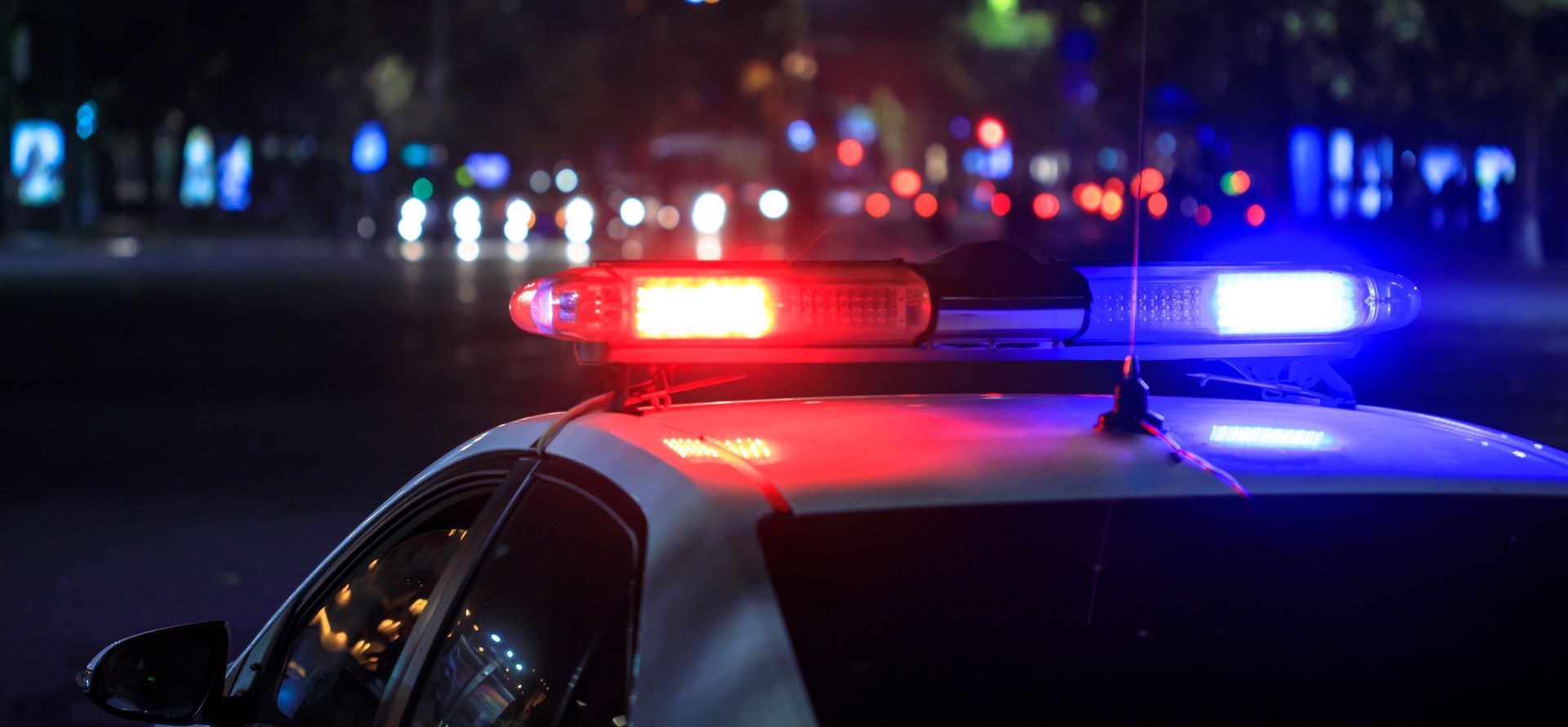 Police lights at night in the city.