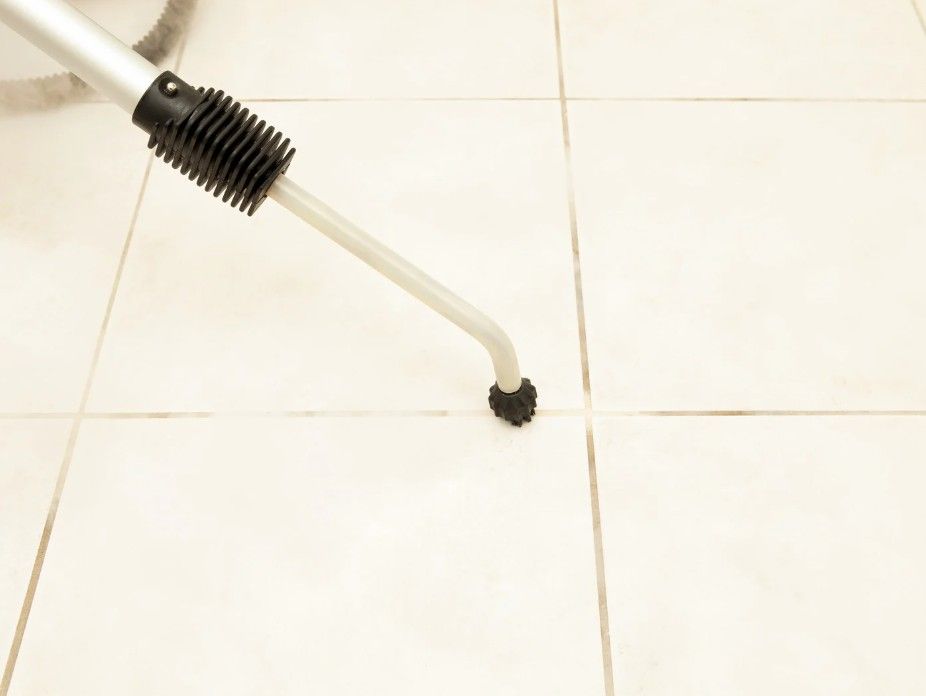 cleaning grout in a bathroom in Derby