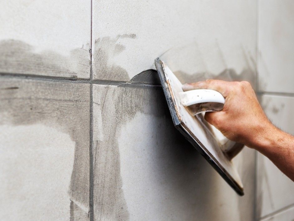 grouting between tiles