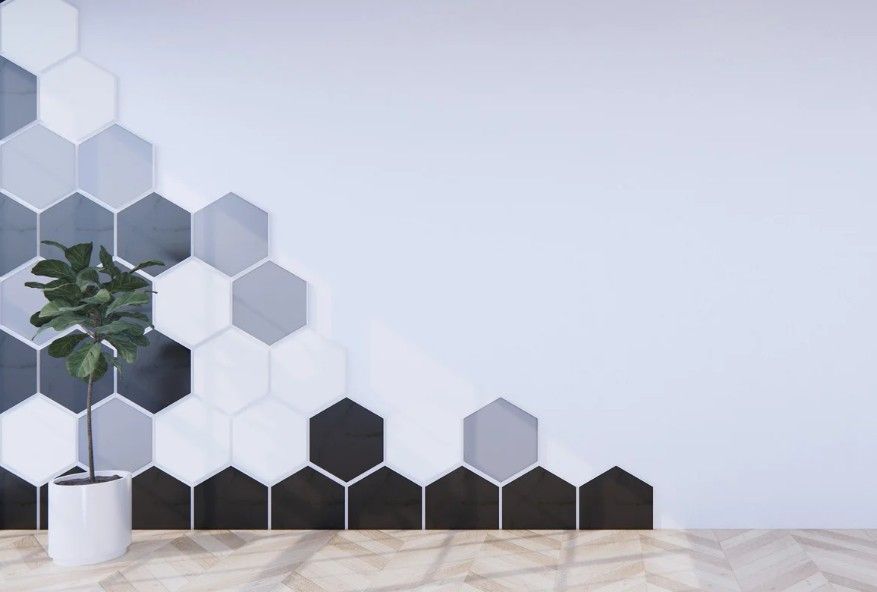 Derbyshire Tiling Specialists part way through fitting small hexagonal tiles in a kitchen in Derby
