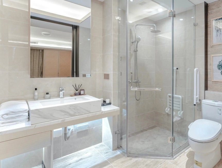 Derbyshire Tiling Specialists tiled bathroom and corner shower unit in Derby