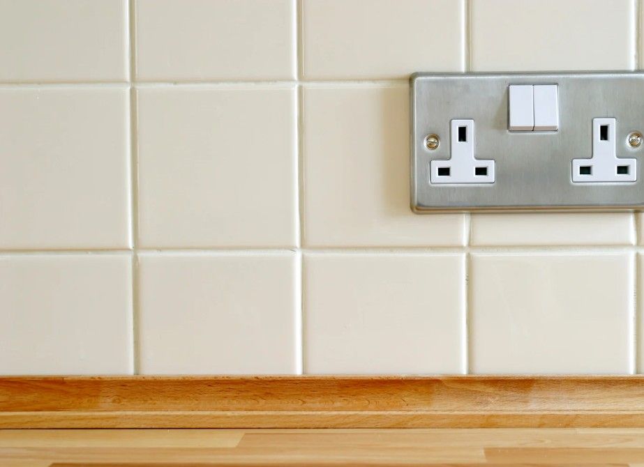 close up of kitchen tilting around a double socket