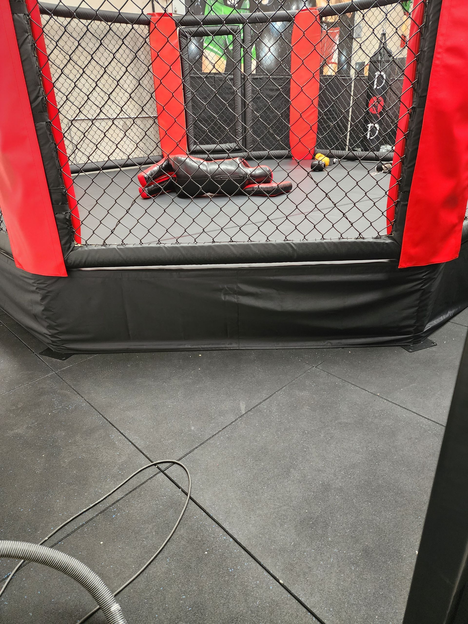 Boxing Ring With A Red And Black Cover - Moorebank, NSW - XS Racking Pty Ltd