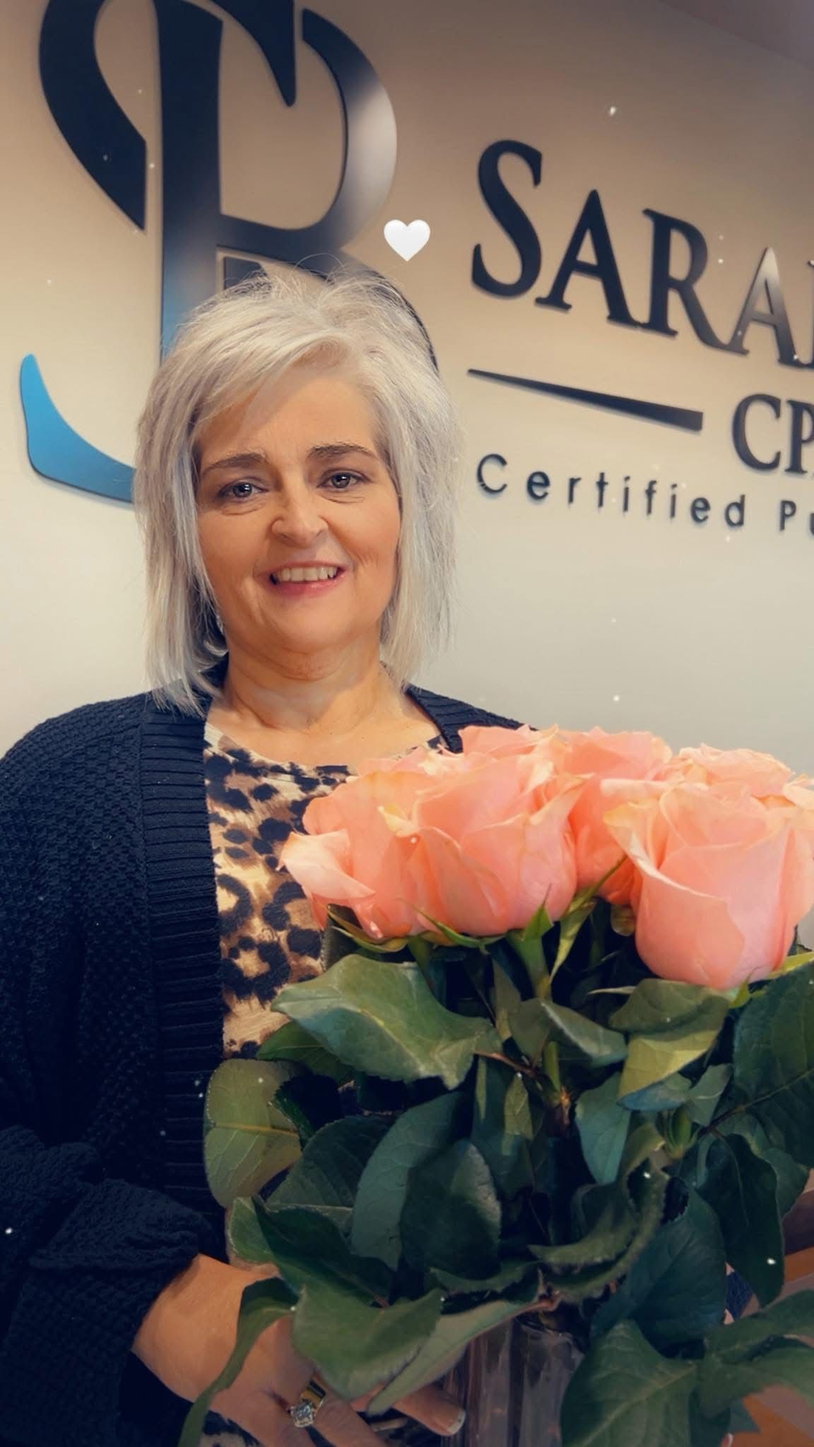 lady standing holding roses