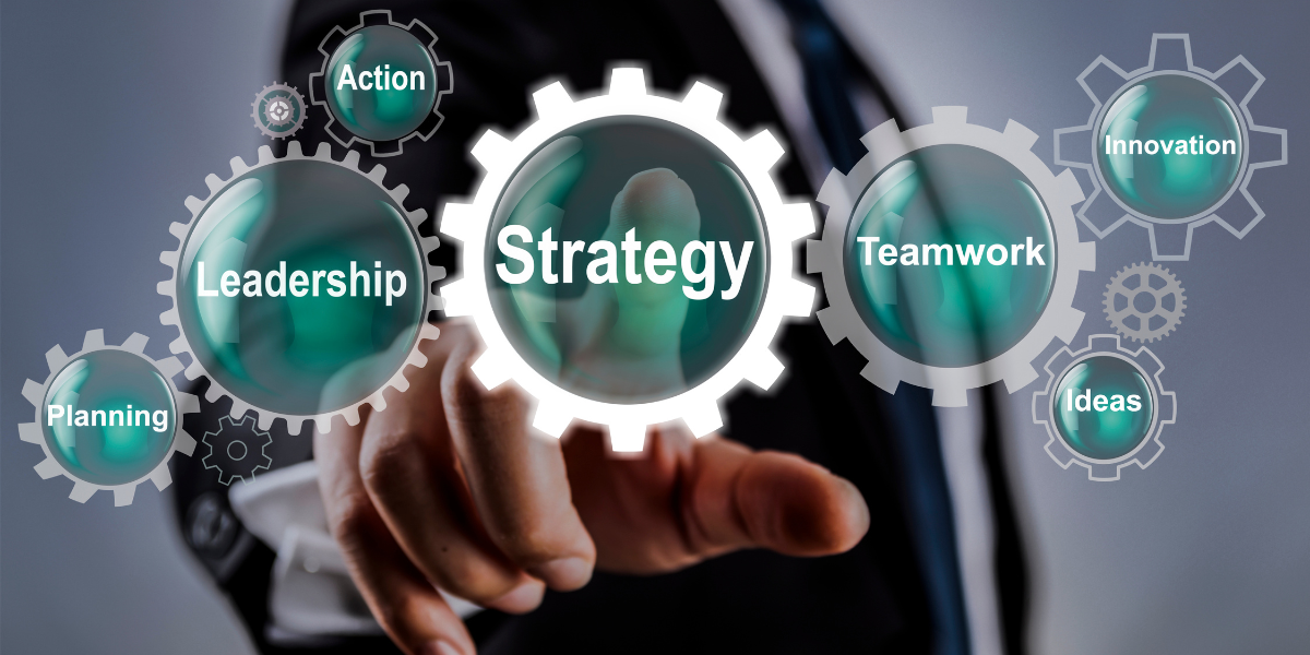 A man is pressing a button on a screen that says strategy.