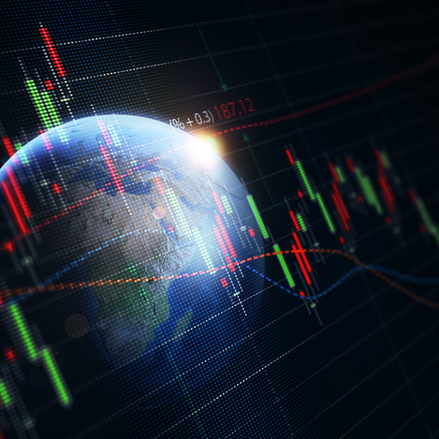 A computer generated image of the earth with a stock chart in the background.