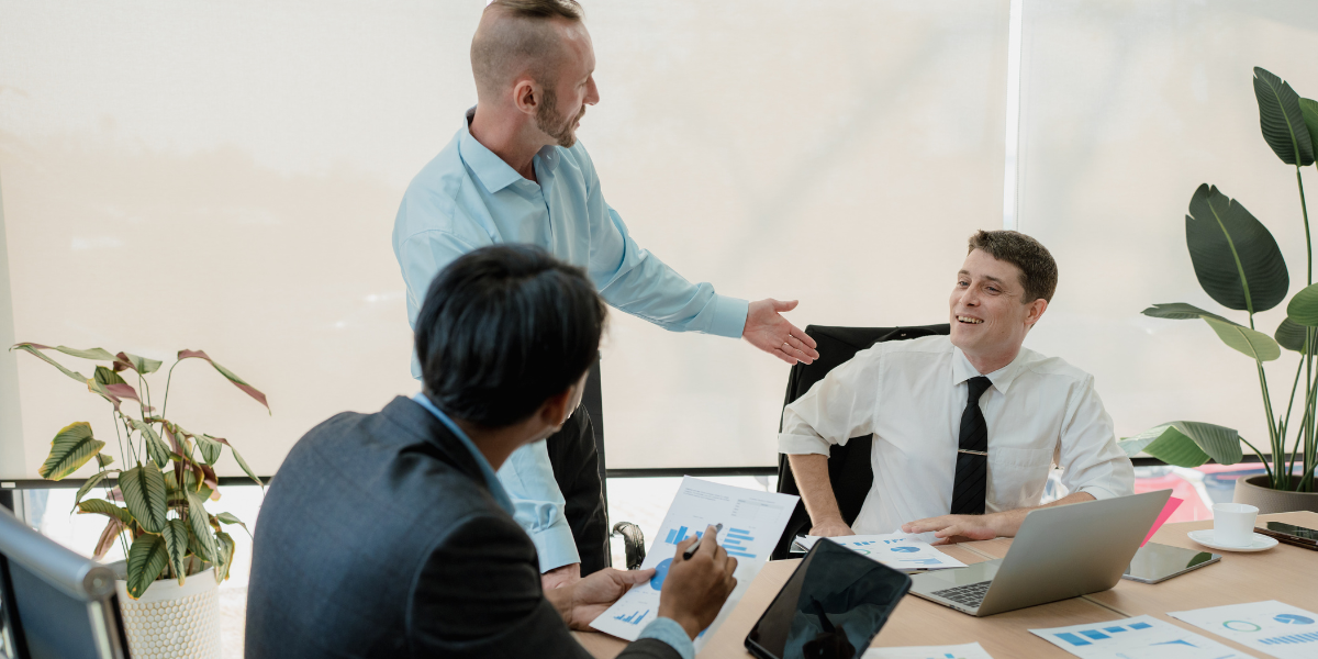 A group of business people are having a meeting in an office.