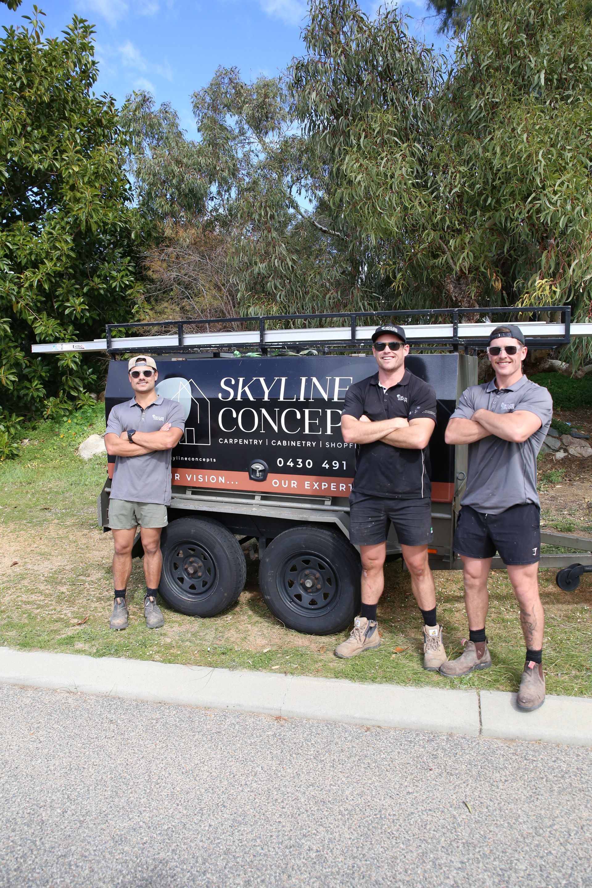 The team from Skyline Concepts standing infront of their work trailer
