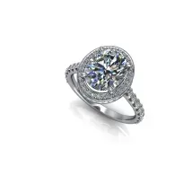 Silver halo diamond engagement ring with pavé band on white background