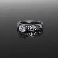 Silver diamond ring on a reflective black surface, shown against a gray background.